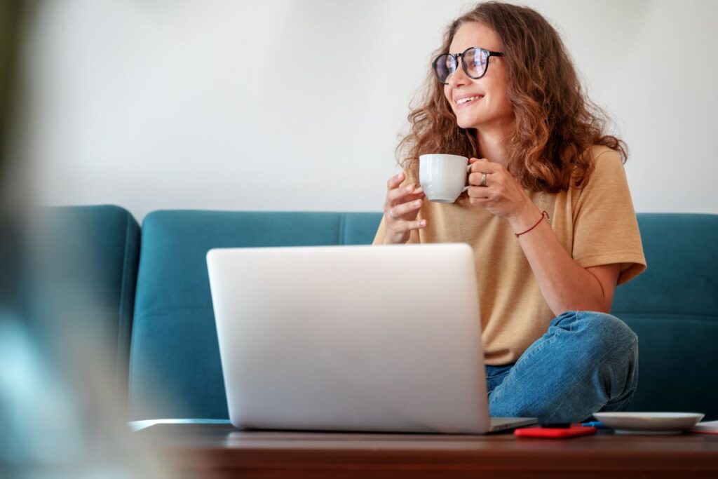 Woman attending an online therapy session at home